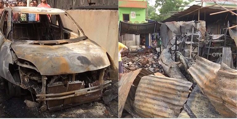 Mangled remains of a car and the shops gutted in Cuttack