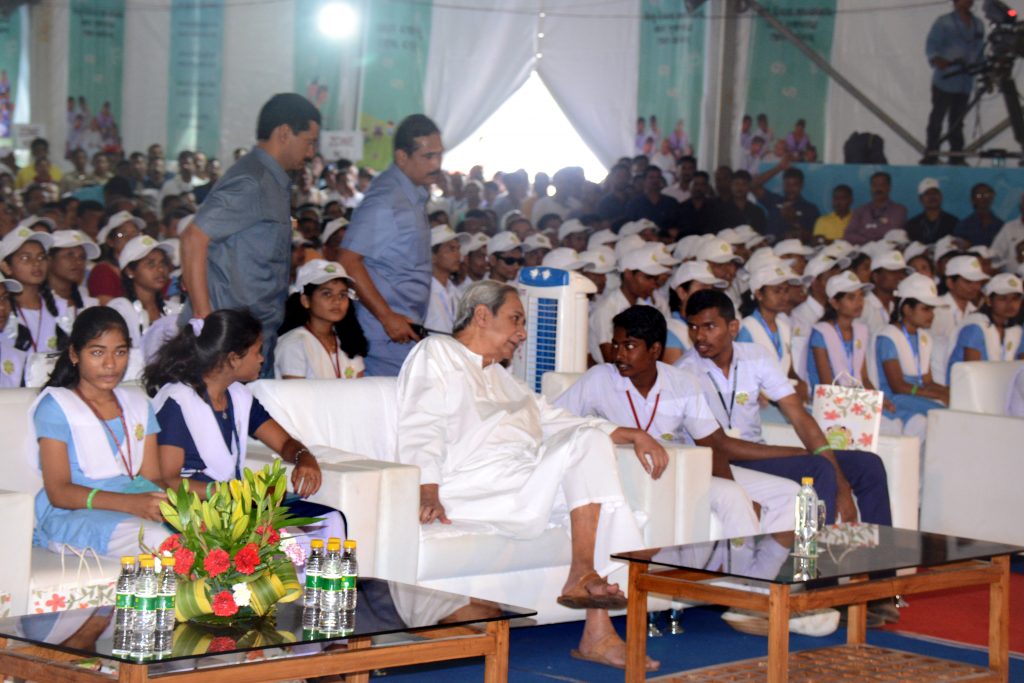 Chief minister Naveen Pattnaik interacts with school children at state level children's day festival in Bhubaneswar on Tuesday.