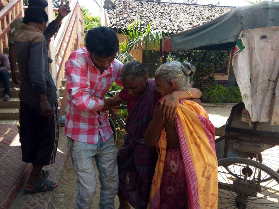 An elderly woman being helped to reach a polling booth for the Bijepur assembly constituency on Saturday. Photograph: OB