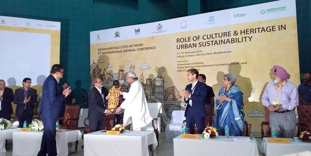 Indian Heritage Network Chairman Dr M Ramachandran presenting CM Naveen Patnaik a memento at the inaugural session of 5th International Biennial Conference of IHCN in Bhubaneswar on Friday. 
