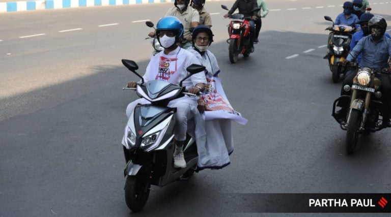 (Watch) West Bengal CM Mamata Banerjee Rides Pillion On Electric Scooter To Protest Fuel Price Hike
