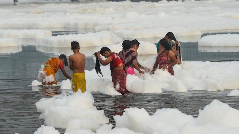 [Watch] People Take Dip In Toxic Foam-Filled Yamuna On Chhath Puja