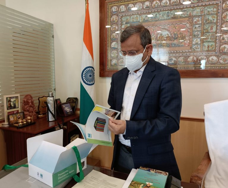 Odisha Chief Secretary Suresh Mohapatra going through PHDMA publications