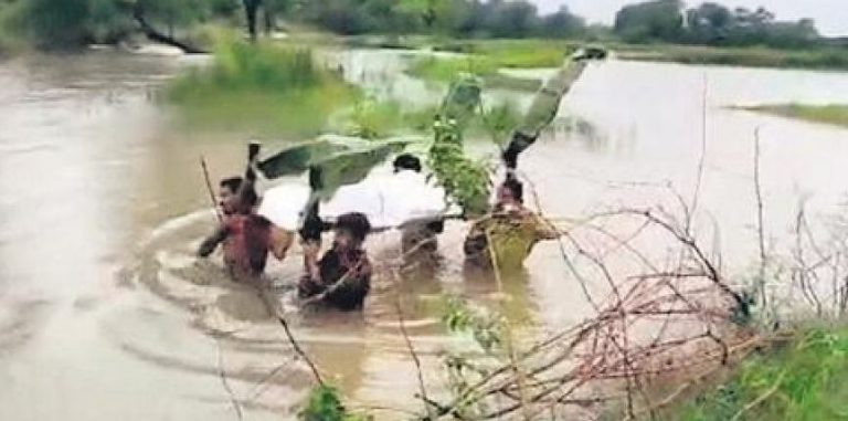 Man’s Body Carried In Chest-Deep Water For Cremation In Odisha’s Kalahandi