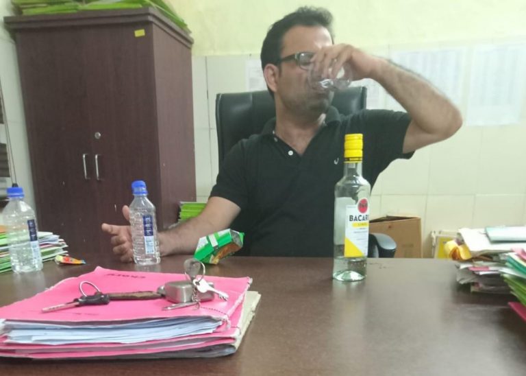 Probe Launched Into Viral Photo Showing Odisha RBSK Official Consuming Liquor In Office