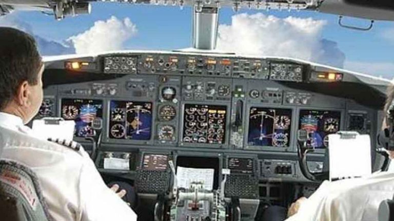 pilots grounded for allowing woman in cockpit