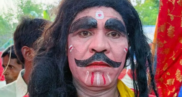 Villager painted face for costume fair in UP