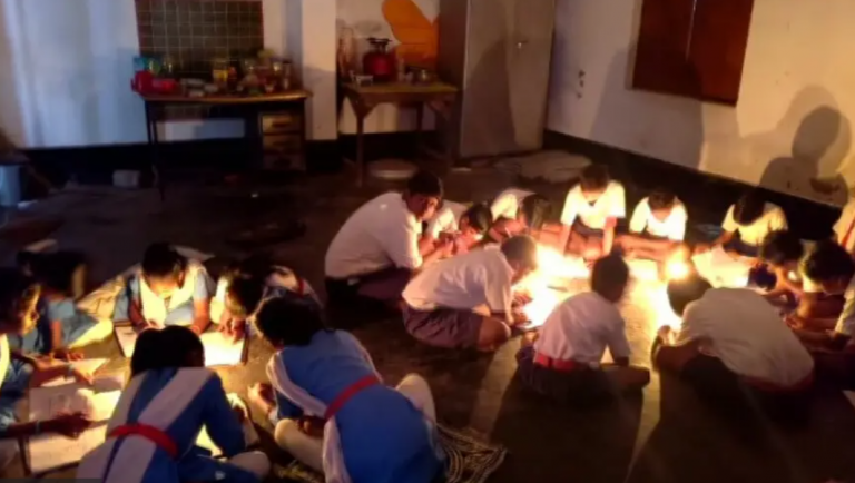 School Children In Odisha’s Puri Appear Exam Under Candle Light