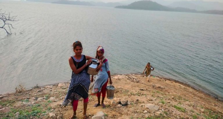Girls bringing water from Sardar Sarovar reservoir