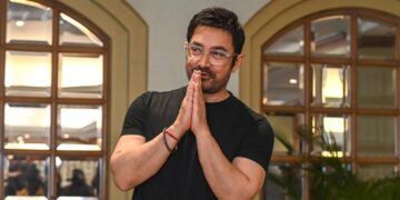 Bollywood actor Aamir Khan gestures as he arrives during his 60th pre-birthday celebrations, in Mumbai on March 13, 2025. (Photo by Sujit JAISWAL / AFP)