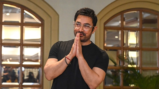 Bollywood actor Aamir Khan gestures as he arrives during his 60th pre-birthday celebrations, in Mumbai on March 13, 2025. (Photo by Sujit JAISWAL / AFP)
