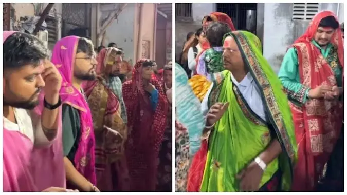 Saree-clad men doing garba
