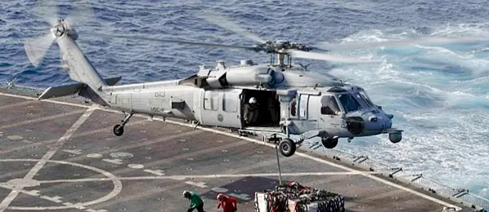 US Navy Continues Search For Crew Member Of Helicopter That Crashed Into Arabian Sea