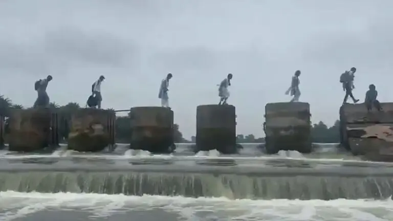 Students taking risk to cross dam