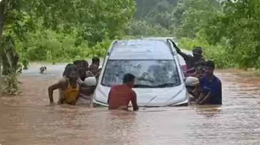 Odisha Teacher Swims To Safety After Floodwater Sweeps Away Car